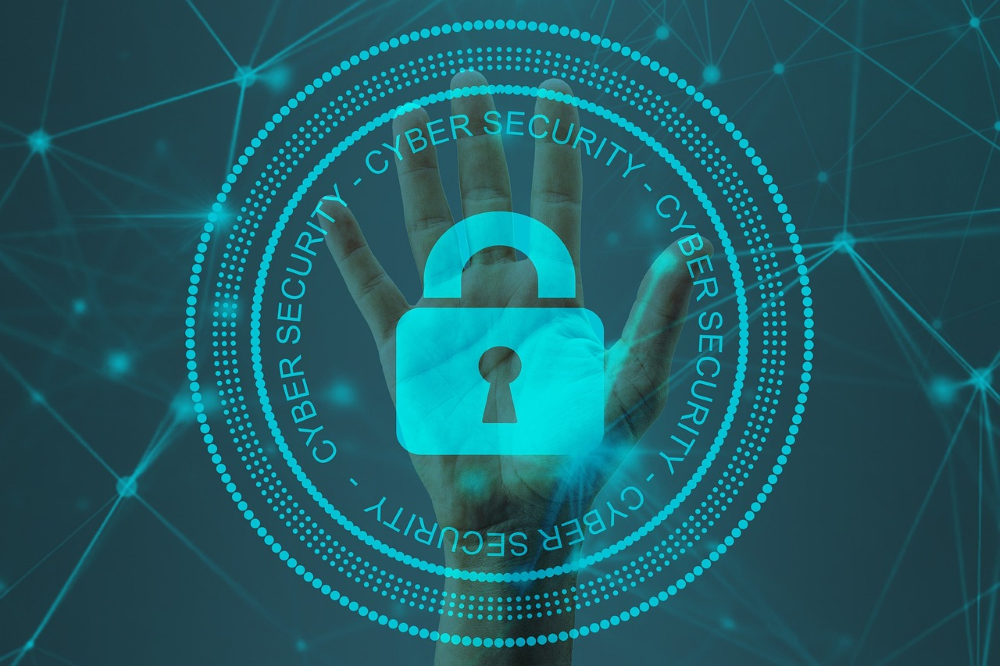 A hand overlayed by a virtual padlock and the words "Cyber security".