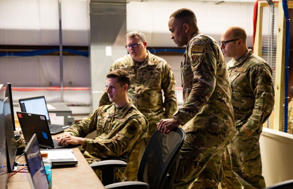 USAF personnel looking at a computer screen