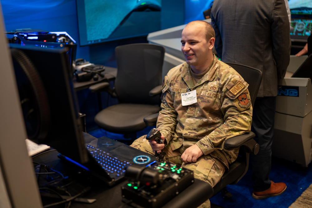 Air Force servicemember testing out a flight simulator