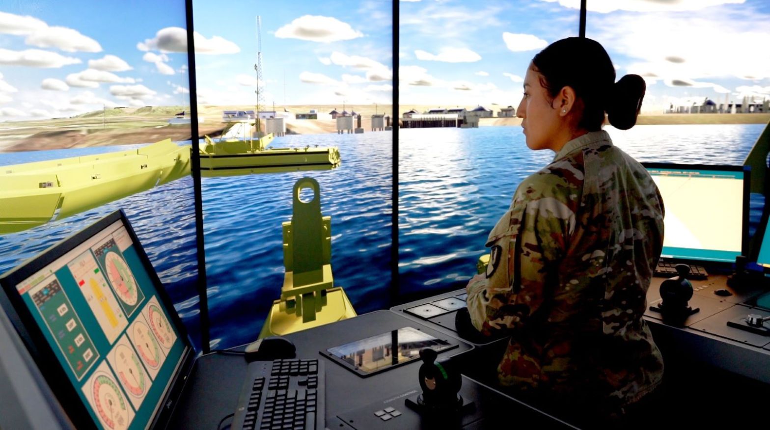 Army Specialist Dayanna Guapisaca navigates a virtual bridge erector boat through a simulation.