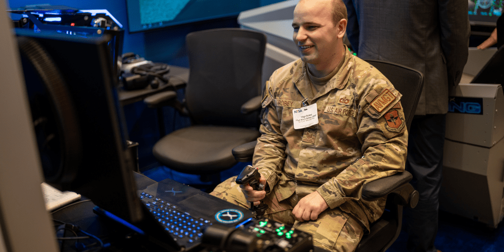 Air Force servicemember testing out a flight simulator