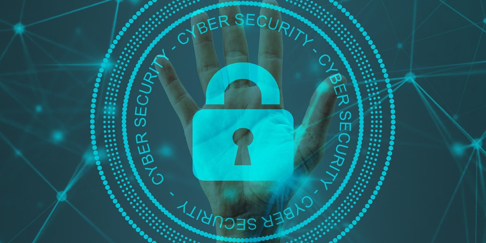 A hand overlayed by a virtual padlock and the words "Cyber security".