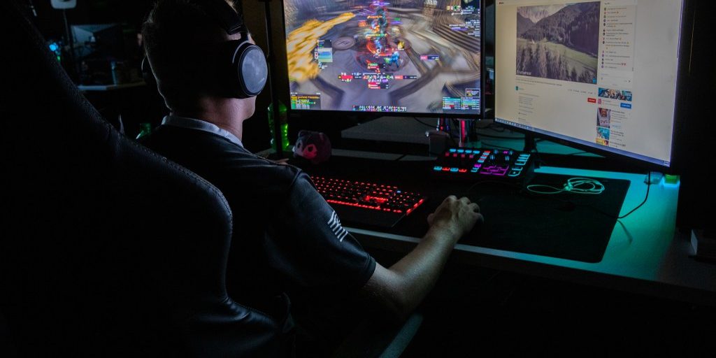 (FORT KNOX, Ky) --- Staff Sgt. Jesse “Neon” Benjamin, a Calvary Scout for the Active Duty Army and a member of the U.S. Army eSports team, competes with one of the gaming rigs located at the eSports Center at Fort Knox, July 16, 2022. Benjamin and the rest of the team played the MMORPG World of Warcraft during the three-day, multinational, joint event benefiting Walking with the Wounded and Hire Heroes USA charities. Every branch of the U.S. Military competed against each other; also competing were the U.S. Coast Guard, British Army, and the Royal British Airforce (U.S. Army photo by Staff. Sgt. Jaccob Hearn).